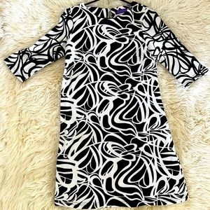 Own this beautiful patterned dress. Use it for an event or simple elegant dinner